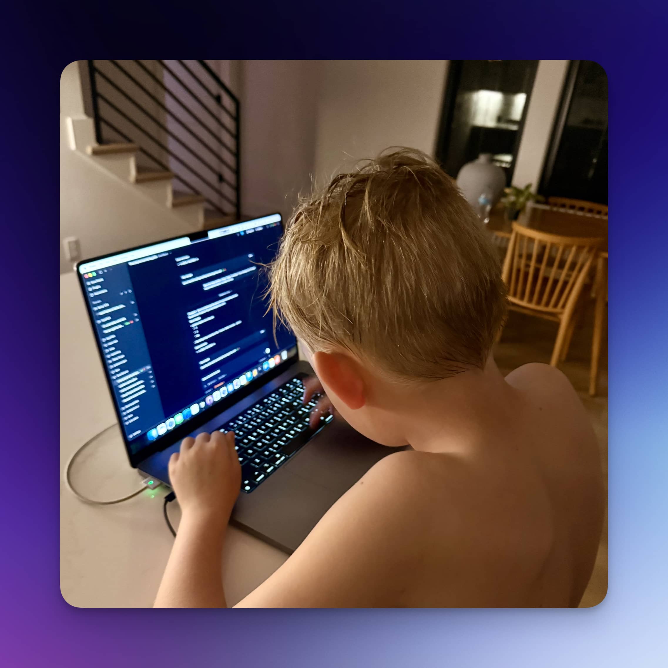 Remy typing on a keyboard on a kitchen counter.